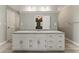 Bathroom with double sink vanity, granite countertop, and ample storage at 2068 Signal Ridge Nw, Kennesaw, GA 30152