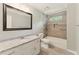 Bright bathroom featuring a granite vanity top, modern fixtures, and a tile shower-over-tub combination at 2068 Signal Ridge Nw, Kennesaw, GA 30152
