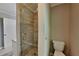 Updated bathroom with glass enclosed shower featuring attractive tile and fixtures at 2068 Signal Ridge Nw, Kennesaw, GA 30152