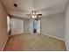 Neutral bedroom featuring plush carpet and a lighted ceiling fan at 2068 Signal Ridge Nw, Kennesaw, GA 30152
