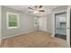 Bright bedroom with carpet flooring, ceiling fan, and natural light at 2068 Signal Ridge Nw, Kennesaw, GA 30152