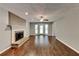 Den with hardwood floors, a brick fireplace, and sliding door access to the patio at 2068 Signal Ridge Nw, Kennesaw, GA 30152