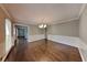 Traditional dining room featuring hardwood floors, large window, and chandelier at 2068 Signal Ridge Nw, Kennesaw, GA 30152