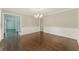 Dining room featuring hardwood floors, chair rail, and modern chandelier at 2068 Signal Ridge Nw, Kennesaw, GA 30152