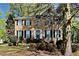 Traditional two-story brick home with black shutters and manicured landscaping at 2068 Signal Ridge Nw, Kennesaw, GA 30152