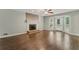 Cozy living room with hardwood floors, a fireplace, and access to an outdoor area at 2068 Signal Ridge Nw, Kennesaw, GA 30152