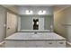 Main bathroom featuring double sinks, granite countertop, and a large mirror at 2068 Signal Ridge Nw, Kennesaw, GA 30152