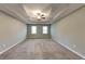 Spacious main bedroom with neutral walls and a tray ceiling with a ceiling fan at 2068 Signal Ridge Nw, Kennesaw, GA 30152