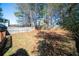 Large fenced backyard with mature trees and a well-maintained lawn offering privacy at 3652 Platina Park Ct, Decatur, GA 30034