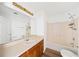 Bathroom with wood vanity, tub and shower at 3652 Platina Park Ct, Decatur, GA 30034