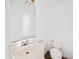 Bathroom with a white toilet and white sink with a large mirror at 3652 Platina Park Ct, Decatur, GA 30034