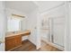 Bathroom featuring a walk-in shower, laminate floors, and a vanity at 3652 Platina Park Ct, Decatur, GA 30034