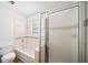 Bathroom featuring a tub and shower combination and framed shower door at 3652 Platina Park Ct, Decatur, GA 30034