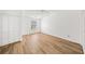 A bright, open bedroom with new laminate floors, a closet, and a ceiling fan at 3652 Platina Park Ct, Decatur, GA 30034
