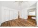 Bedroom showcasing new laminate flooring, closet, and doorway to the hallway at 3652 Platina Park Ct, Decatur, GA 30034