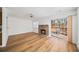 Bright living room with a brick fireplace, sliding glass doors to outdoor space at 3652 Platina Park Ct, Decatur, GA 30034