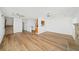 Open layout featuring modern flooring, brick fireplace, and adjacent kitchen at 3652 Platina Park Ct, Decatur, GA 30034