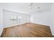 Bright living room with wood-look floors, ceiling fans, and natural light at 3652 Platina Park Ct, Decatur, GA 30034
