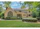 Beautiful backyard featuring a spacious deck, lush lawn, and mature trees at 6030 Sweet Creek Rd, Duluth, GA 30097
