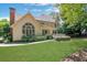 A charming home surrounded by lush greenery and a well-maintained lawn at 6030 Sweet Creek Rd, Duluth, GA 30097