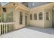Cozy back porch with white railing and plenty of light from the house's many windows at 6030 Sweet Creek Rd, Duluth, GA 30097