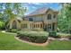Expansive backyard featuring a deck, lush lawn, and multiple windows providing plenty of natural light indoors at 6030 Sweet Creek Rd, Duluth, GA 30097