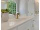 This bathroom features a white vanity and a window overlooking a green landscape at 6030 Sweet Creek Rd, Duluth, GA 30097
