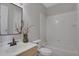 This bathroom is equipped with a sink, toilet, and shower with a tub at 6030 Sweet Creek Rd, Duluth, GA 30097