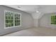 Carpeted bedroom featuring abundant natural light at 6030 Sweet Creek Rd, Duluth, GA 30097