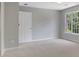 Spacious bedroom featuring a window with natural light at 6030 Sweet Creek Rd, Duluth, GA 30097