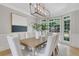 Bright dining room featuring a modern chandelier, large windows, and stylish decor at 6030 Sweet Creek Rd, Duluth, GA 30097