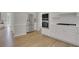 Kitchen showcasing stainless steel appliances, white cabinets, and hardwood flooring at 6030 Sweet Creek Rd, Duluth, GA 30097