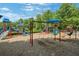Colorful playground with slides, swings, and climbing structures for ' enjoyment at 6030 Sweet Creek Rd, Duluth, GA 30097