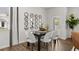 Cozy dining room with modern lighting, seating for six, and a view of the backyard at 2366 Haran Dr # 37, Lithonia, GA 30058