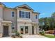 Charming townhome exterior with light-colored siding, brick accents, and well-maintained landscaping at 2366 Haran Dr # 37, Lithonia, GA 30058