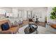 Open-concept living space with modern kitchen, living room with stylish furniture, and dining area at 2366 Haran Dr # 37, Lithonia, GA 30058