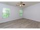 This bedroom features durable flooring and two windows at 301 Silver Spring St, Dallas, GA 30157