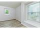 Bright bedroom with large windows and neutral walls at 301 Silver Spring St, Dallas, GA 30157