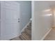 Inviting entryway with a white front door and staircase leading upstairs at 301 Silver Spring St, Dallas, GA 30157