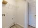 Laundry room with shelf, hookups, durable flooring, and easy access to outside at 301 Silver Spring St, Dallas, GA 30157