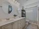 A bathroom featuring double sinks, granite countertops, and a shower/tub at 3174 Piney Woods Cir, Buford, GA 30519