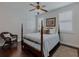 A cozy bedroom with natural light and a four poster bed at 3174 Piney Woods Cir, Buford, GA 30519