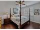 A cozy bedroom with natural light and a four poster bed at 3174 Piney Woods Cir, Buford, GA 30519
