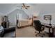 Cozy bedroom with a four-poster bed and a comfortable workspace, offering a relaxing retreat at 3174 Piney Woods Cir, Buford, GA 30519