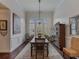 Formal dining room boasts ample seating, natural light, and elegant decor perfect for hosting memorable gatherings at 3174 Piney Woods Cir, Buford, GA 30519