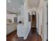 A hallway that provides entry to the kitchen and a staircase at 3174 Piney Woods Cir, Buford, GA 30519