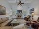 Cozy living room features a stone fireplace, hardwood floors, and coffered ceilings for a luxurious and comfortable ambiance at 3174 Piney Woods Cir, Buford, GA 30519
