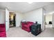 Finished basement featuring comfortable seating and ample lighting at 3885 Weeping Willow Ln, Loganville, GA 30052