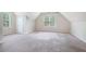 Open bonus room featuring carpet, neutral walls, natural light and dormer ceiling at 3885 Weeping Willow Ln, Loganville, GA 30052