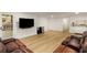 Finished basement area with recliners, exterior access, TV and vinyl flooring, ideal for entertainment at 8260 Overview Ct, Roswell, GA 30076
